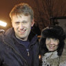 ussian opposition leader Alexei Navalny, left, and his wife Yulia are surrounded by journalists after he is released from police custody on the outskirts of Moscow early Wednesday, December. 21, 2011.
