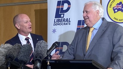 Enemies Campbell Newman and Clive Palmer turn mates for votes