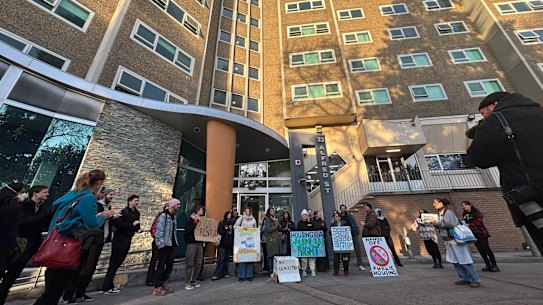 Protesters outside the housing tower at 33 Alfred Street, North Melbourne on Monday morning.
