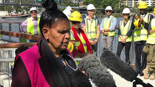 Turrbal woman Maroochy Barambah explains the Aboriginal totems on a new walkway along the Brisbane River.