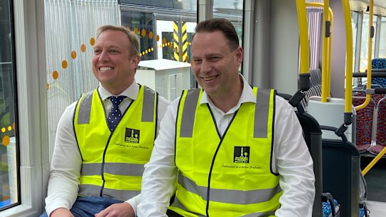 Miles and Schrinner are all smiles after announcing the state government will boost its share of bus funding.