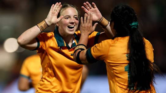 YORK, ENGLAND - AUGUST 30: Caitlyn Halse of Australia celebrates with teammate Cecilia Smith after scoring her team’s fourth try during the Women’s Rugby World Cup 2025 Pool A match between USA and Australia at the York Community Stadium on August 30, 2025 in York, England. (Photo by Stu Forster/Getty Images)