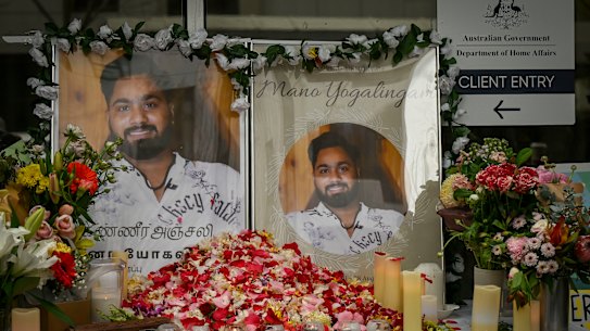 
Protesters outside the Department of Home Affairs Office in Melbourne’s Docklands on Thursday display portraits of a 23-year-old asylum seeker who died in Melbourne on Wednesday after setting himself on fire.
