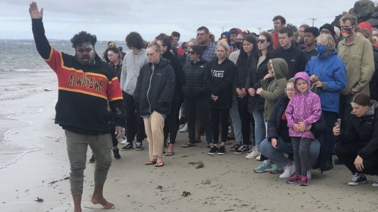 Gunditjmara man Chris Saunders invites those attending the smoking ceremony at the Convincing Ground, near Portland, to remember the spirits of those massacred on the beach.