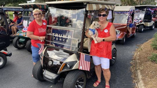 Friends Dorothy Sullivan and Carol McNeal at a pro-Trump golf cart parade in The Villages, Florida.