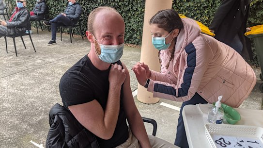 Liam receiving his first dose of AstraZeneca.