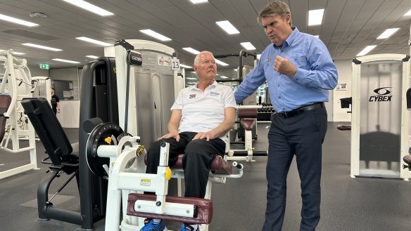 Professor Rob Newton (right) with patient Michael Pittaway (right) at the gym in the