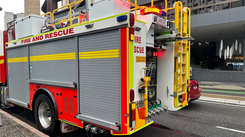 Two women fighting for life after forklift fire spreads in Brisbane