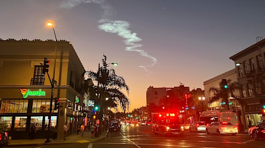 The trail of the SpaceX Falcon 9 rocket is seen in the sky from Pasadena after launch from Vandenberg Space Force Base in California, carrying 53 Starlink satellites into orbit.