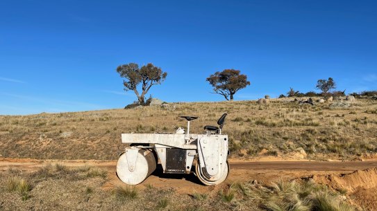 I’m cowering in a vehicle with the windows up on a hot evening, staring at the sliver of dark beneath a doorstep.