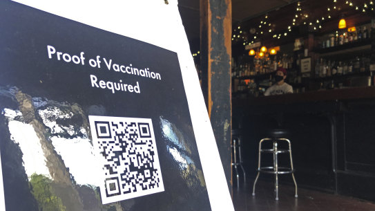A proof of vaccination sign is posted at a bar in San Francisco on Thursday, July 29, 2021.