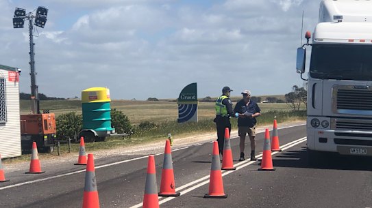 Police at the South Australia-Victoria border post near Nelson on Wednesday.
