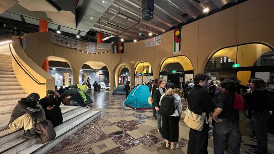 Students gather in the central lobby of the Arts West building at Melbourne University on Thursday night.
