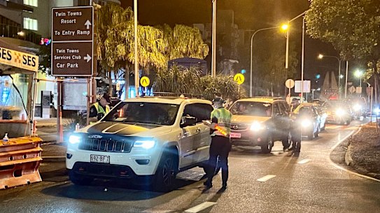 Some of the first people crossing the Queensland border, which opened earlier than 1am.