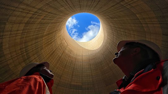 The ultimate echo chamber: Greenspot chief executive Brett Hawkins (left) and part owner Neil Schembri look skyward from inside the cooling tower of the shuttered Wallerawang Power Station. 