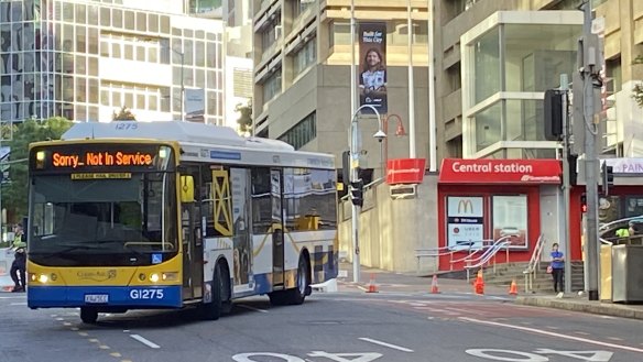 Police forensic crash unit experts photograph a Brisbane City Council bus as it travels from Ann Street into Edward Street as aprt of the investigation into the death of 18-year-old Tia Cameron on March 8.