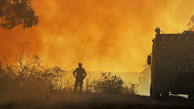 A member of a Rural Fire Service strike team at a blaze near Bean Creek, north west of Casino.