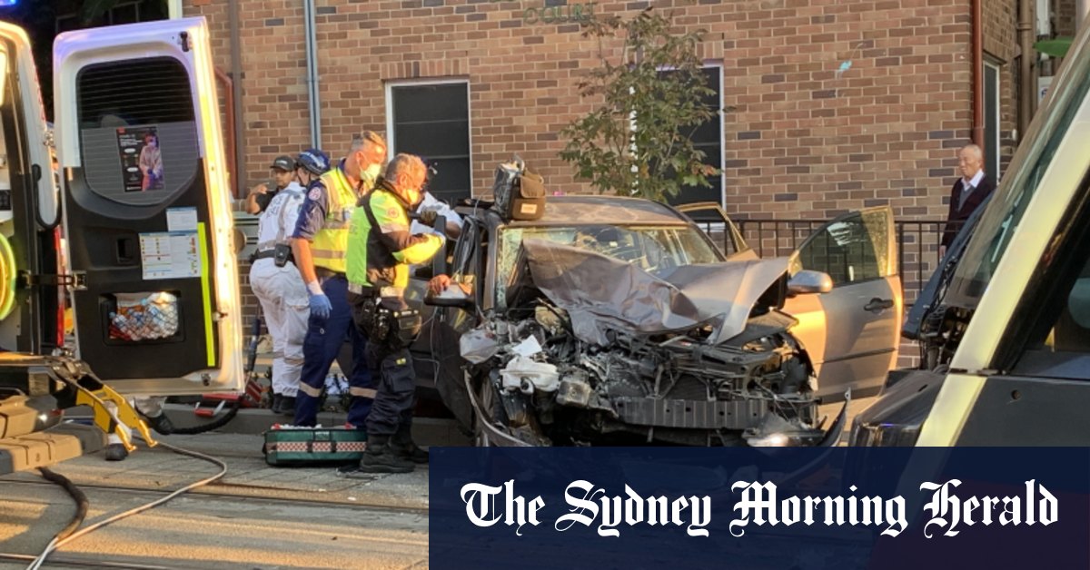 Driver trapped in Sydney CBD car and light rail collision