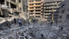 Rescue workers search for victims at the site of an Israeli airstrike that hit central Beirut.
