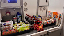 There was so much food loaded onto the flight some had to be stored in the overhead bins.