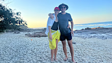 Sylvia and husband Peter (right) swap the news room for sand dunes. 