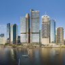 An artist’s impression of the Waterfront Brisbane development, with Riparian Plaza to the right.