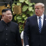 U.S. President Donald Trump and North Korean leader Kim Jong Un take a walk after their first meeting.
