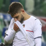 Domenico Berardi heads off the field after Italy missed direct qualification for the World Cup.