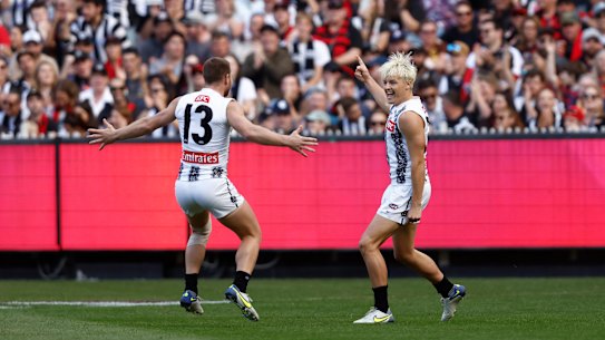 Jack Ginnivan celebrates a goal with teammate Taylor Adams.