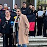 Raelene Cooper, lawyers and supporters address media outside the Federal Court in Sydney this morning.