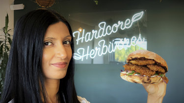 Shama Sukul Lee, the founder of Sunfed, with a burger made using her chicken free chicken product.