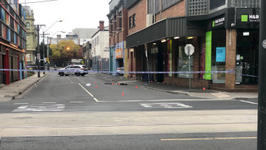 Detectives at the scene of a drive-by shooting outside the Love Machine nightclub in Prahran.