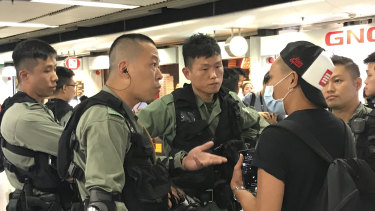 Gary is stopped by riot police at Admiralty MTR.