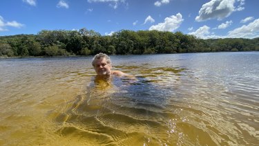 Conservationist Greg Wood is among many warning about the impact of private cabins beside Poona Lake in Cooloola.