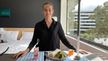 Stacey Binnion brings a bit of flair to her supplied hotel quarantine meal at the Holiday Inn at Melbourne airport.
