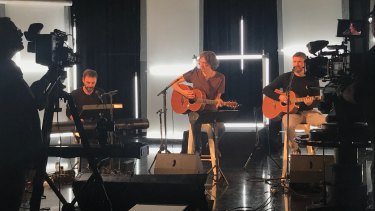 (L-R) Johnny McDaid, Gary Lightbody and Nathan Connolly of the Snow Patrol performing an intimate gig to promote new album Wildness at Studio Max, Foxtel, on Monday.