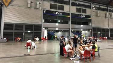Temporary home: Affected residents inside the Sydney Showgrounds' exhibition hall late on Monday evening. 