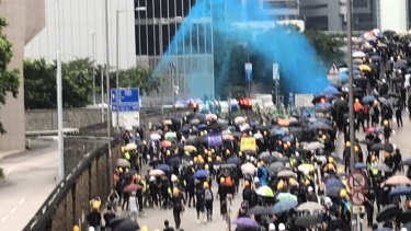 Police fire blue dye at protesters designed to identify them after they leave a scene.
