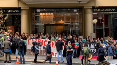 Extinction Rebellion protesters block the entrance to BHP offices in Melbourne