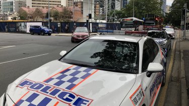 Fire trucks and police vehicles blocked two lanes on Alice Street outside State Parliament’s main entrance.
