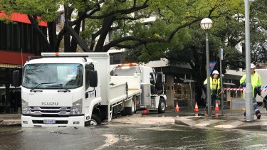 A truck partially fell through the road after a water main collapsed at Double Bay.