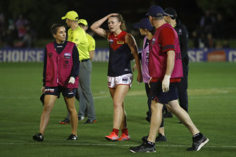 Ainslie Kemp leaves the field injured on Friday. 