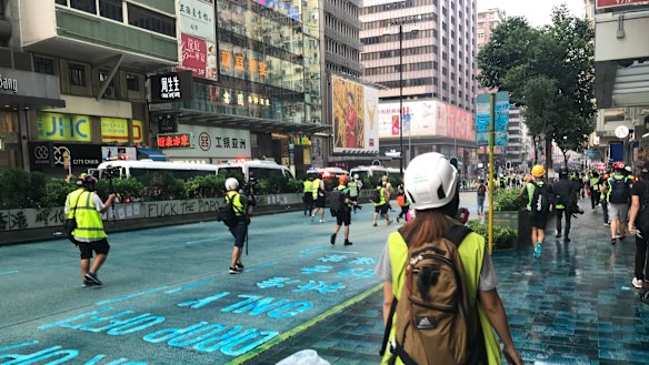 Streets were stained blue from a police water cannon containing blue dye and pepper spray.