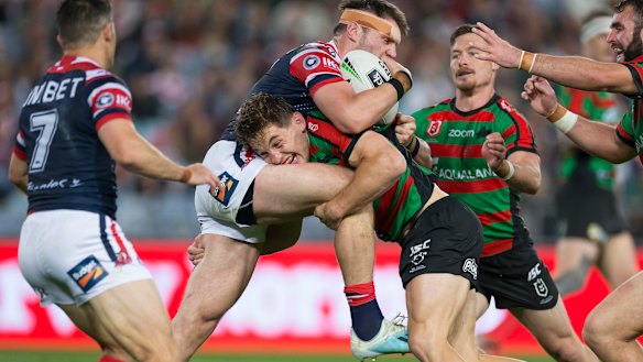 Cameron Murray up-ends Roosters forward Angus Crichton at ANZ Stadium on Thursday night.