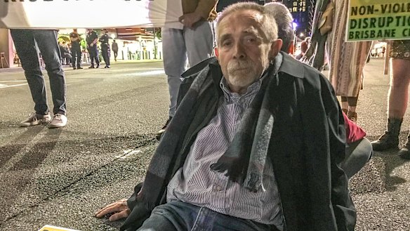 Brisbane man Frank Moeller glued his fingers to Grey Street on Friday night.