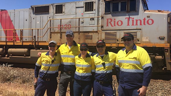 Rio Tinto Iron Ore AutoHaul team celebrating the success of the first autonomous rail journey from Wombat Junction to Paraburdoo.