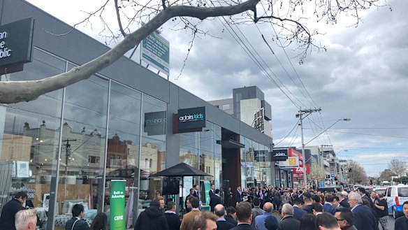 The crowd at the auction of the Adairs building on Bridge Road, Richmond on Thursday.
