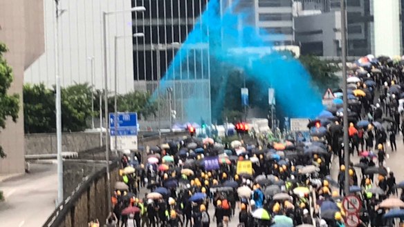 Police fire blue dye at protesters designed to identify them after they leave a scene.