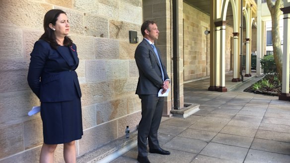 Premier Annastacia Palaszczuk and Health Minister Steven Miles watch as the Chief Health Officer explains her health advice about the Queensland-NSW border.