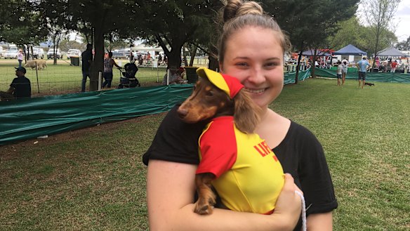 Dressed like a lifesaver, Winston, in the arms of owner Brooke Tierney, won the best dressed category of the "dapper dogs" competition at the Bungendore Show on Sunday.